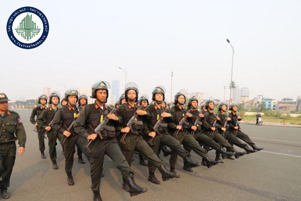 Động tác đặt lá chắn, gậy cao su, mũ đặc chủng trong điều lệnh đội ngũ Công an nhân dân được quy định như thế nào?